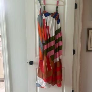 Designer dress, never worn. Comes with matching sash for belt